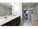 Clean bathroom with double sinks and a walk-in shower at 8896 Cabot Cliffs Dr, Davenport, FL 33896