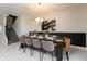 Elegant dining room featuring a large table and modern chandelier at 8896 Cabot Cliffs Dr, Davenport, FL 33896