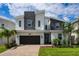 Modern two-story house with stone accents at 8896 Cabot Cliffs Dr, Davenport, FL 33896