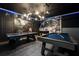 Fun game room with a pool table, air hockey, and Star Wars theme at 8896 Cabot Cliffs Dr, Davenport, FL 33896