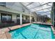 Inviting pool and spa with screened enclosure at 8896 Cabot Cliffs Dr, Davenport, FL 33896