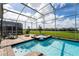 Screened pool and spa with ample patio space at 8896 Cabot Cliffs Dr, Davenport, FL 33896