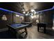 Fun game room with pool table, foosball, and Star Wars themed decor at 8896 Cabot Cliffs Dr, Davenport, FL 33896