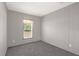 Spacious bedroom with neutral carpeting and a window at 18746 Seaford Ave, Orlando, FL 32820