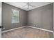 Bright bedroom with neutral walls and ceiling fan at 41 E Spruce St, Orlando, FL 32804