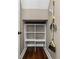 Small storage closet with shelving and broom hanging at 41 E Spruce St, Orlando, FL 32804
