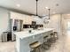Modern kitchen with island, white cabinets, and stainless steel appliances at 1861 Sawyer Palm Pl, Kissimmee, FL 34747