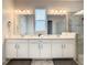 Bathroom with double vanity and bright lighting at 1861 Sawyer Palm Pl, Kissimmee, FL 34747