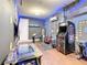 Game room with Pac-Personal themed decor, arcade games, and a large TV at 1861 Sawyer Palm Pl, Kissimmee, FL 34747