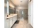 Double vanity bathroom with large walk-in shower at 1861 Sawyer Palm Pl, Kissimmee, FL 34747