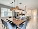 Open concept dining room with modern table and chairs at 1861 Sawyer Palm Pl, Kissimmee, FL 34747