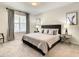 Spacious bedroom with king-size bed and neutral decor at 1861 Sawyer Palm Pl, Kissimmee, FL 34747