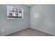 Small bedroom with a window and grey carpet at 2319 Continental Blvd, Orlando, FL 32808