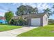 House exterior with a spacious driveway and well-kept lawn at 2319 Continental Blvd, Orlando, FL 32808