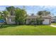 One-story home with a spacious lawn and attached garage at 2319 Continental Blvd, Orlando, FL 32808
