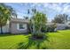 Well-maintained lawn and landscaping in front of a charming single-story home at 2319 Continental Blvd, Orlando, FL 32808