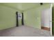 Bright bedroom with grey carpet and light green walls at 2319 Continental Blvd, Orlando, FL 32808