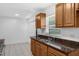 Kitchen with granite countertops, wood cabinets, and a double sink at 2319 Continental Blvd, Orlando, FL 32808