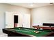 Game room with billiard table and access to wet bar at 4535 Narrative Ln, Kissimmee, FL 34746