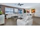Spacious living room with comfortable seating and large windows at 4535 Narrative Ln, Kissimmee, FL 34746