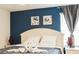 Bright bedroom with a king-size bed and stylish decor at 4535 Narrative Ln, Kissimmee, FL 34746
