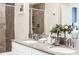 Bathroom with double vanity, granite countertop, and shower at 4535 Narrative Ln, Kissimmee, FL 34746