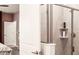 Bathroom with walk-in shower and tiled walls at 4535 Narrative Ln, Kissimmee, FL 34746