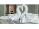 Close-up of neatly folded towels arranged as swans at 4535 Narrative Ln, Kissimmee, FL 34746