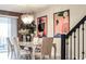 Elegant dining room with a large table and statement lighting at 4535 Narrative Ln, Kissimmee, FL 34746