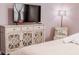 Bedroom with TV stand and decorative chair at 4535 Narrative Ln, Kissimmee, FL 34746