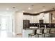 Modern kitchen with stainless steel appliances and island at 4535 Narrative Ln, Kissimmee, FL 34746