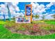 Community entrance sign for Storey Lake, featuring palm trees and a relaxing lakeside scene at 4535 Narrative Ln, Kissimmee, FL 34746