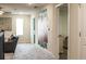 Upstairs hallway with large artwork and access to bedrooms at 4535 Narrative Ln, Kissimmee, FL 34746