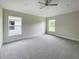 Spacious bedroom with carpet flooring and large windows at 4394 Sagefield Dr, Harmony, FL 34773