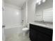 Bathroom with shower/tub combo and dark vanity at 4394 Sagefield Dr, Harmony, FL 34773