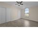 Bedroom with vaulted ceiling, ceiling fan, and large arched window at 216 Shady Oaks Cir, Lake Mary, FL 32746