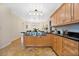 Bright kitchen with island and view into dining area at 411 Sheridan Blvd, Orlando, FL 32804