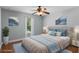 Virtually staged bedroom with wood floors at 2978 Ruxton Dr, Apopka, FL 32712