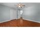 Bedroom with double door closet and wood floors at 2978 Ruxton Dr, Apopka, FL 32712