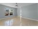 Bright living room with tile flooring, large window, and view of entryway at 2978 Ruxton Dr, Apopka, FL 32712