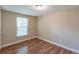 Well-lit bedroom with hardwood floors and a window at 1506 W 16Th St, Sanford, FL 32771