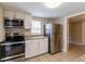 Modern kitchen featuring stainless steel appliances and white cabinets at 1506 W 16Th St, Sanford, FL 32771
