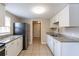 Updated kitchen with granite countertops and white cabinets at 1506 W 16Th St, Sanford, FL 32771