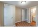 Bedroom with wood-look floors and access to a full bathroom at 1506 W 16Th St, Sanford, FL 32771