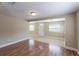 Bright living room with hardwood floors and neutral walls at 1506 W 16Th St, Sanford, FL 32771