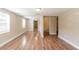 Living room with hardwood floors and access to bathroom at 1506 W 16Th St, Sanford, FL 32771