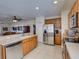 Modern kitchen featuring stainless steel appliances and light wood cabinets at 535 Crimson Ln, Winter Springs, FL 32708