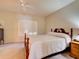 Comfortable bedroom with a wooden bed frame and window shutters at 535 Crimson Ln, Winter Springs, FL 32708