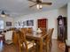 Bright dining area with wooden table and chairs, hardwood floors, and large windows at 535 Crimson Ln, Winter Springs, FL 32708