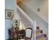 Elegant staircase with white railings and carpeted steps at 535 Crimson Ln, Winter Springs, FL 32708
